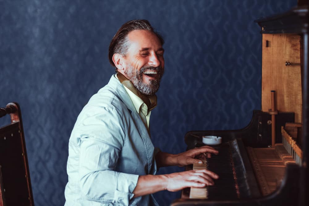 Play piano by ear - Composer playing piano
