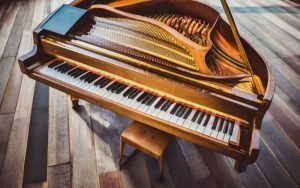Is piano a string instrument or percussion instrument? is a piano a string instrument